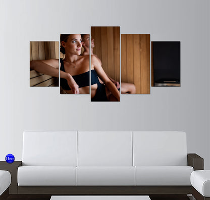 Woman Relaxing in a Warm Wooden Sauna