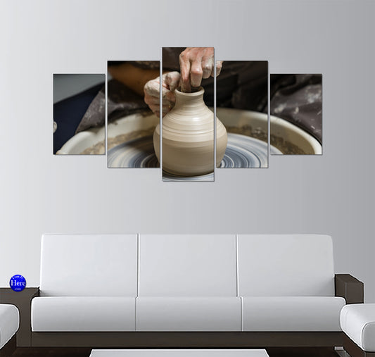 Artisan Potter Shaping a Clay Vase on a Pottery Wheel