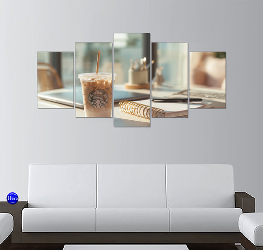 Starbucks Iced Coffee Beside a Gold Spiral Notebook