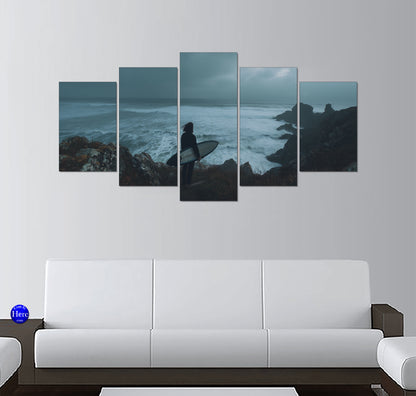 Lone Surfer Holding a Surfboard Above Stormy Coastal Waves