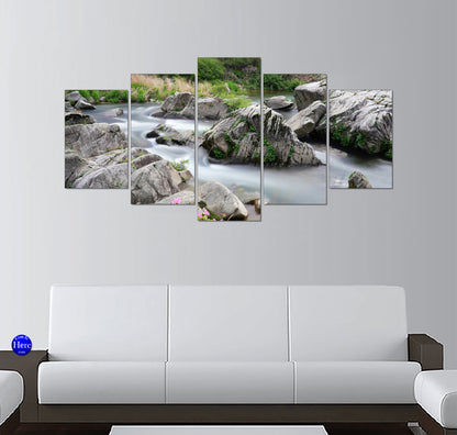 Long-Exposure Mountain Stream Among Gray Boulders and Moss