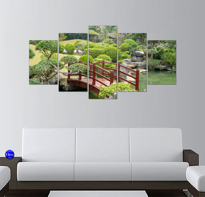 Red Arched Footbridge Over a Jade Pond in a Japanese Zen Garden