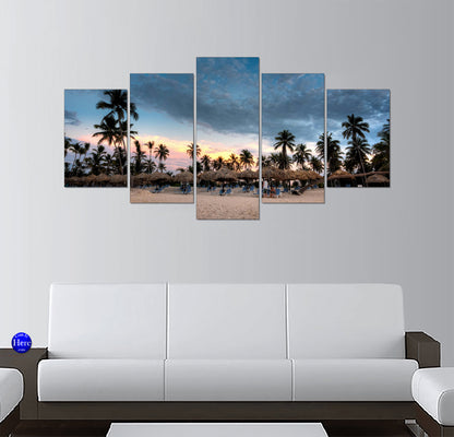 Tropical Beach Resort With Palapa Umbrellas and Palm Trees at Dusk